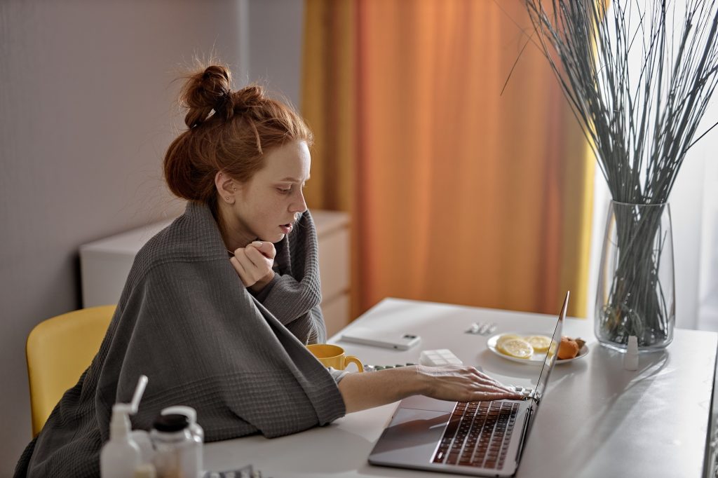 young hardworking beautiful sick female student preparing for exams