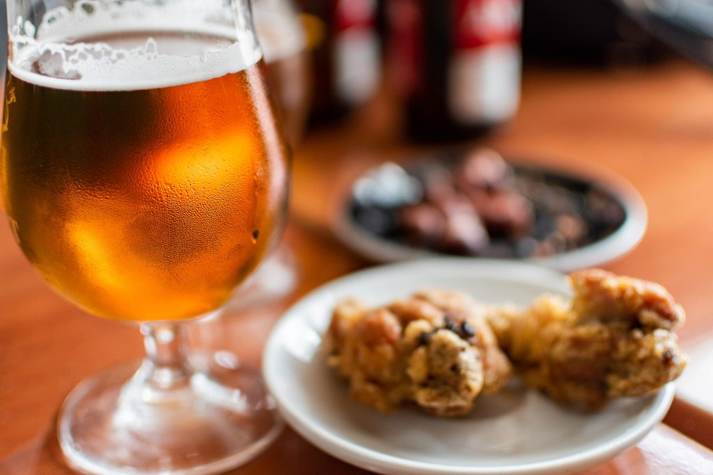 Beer glass with tapas food.