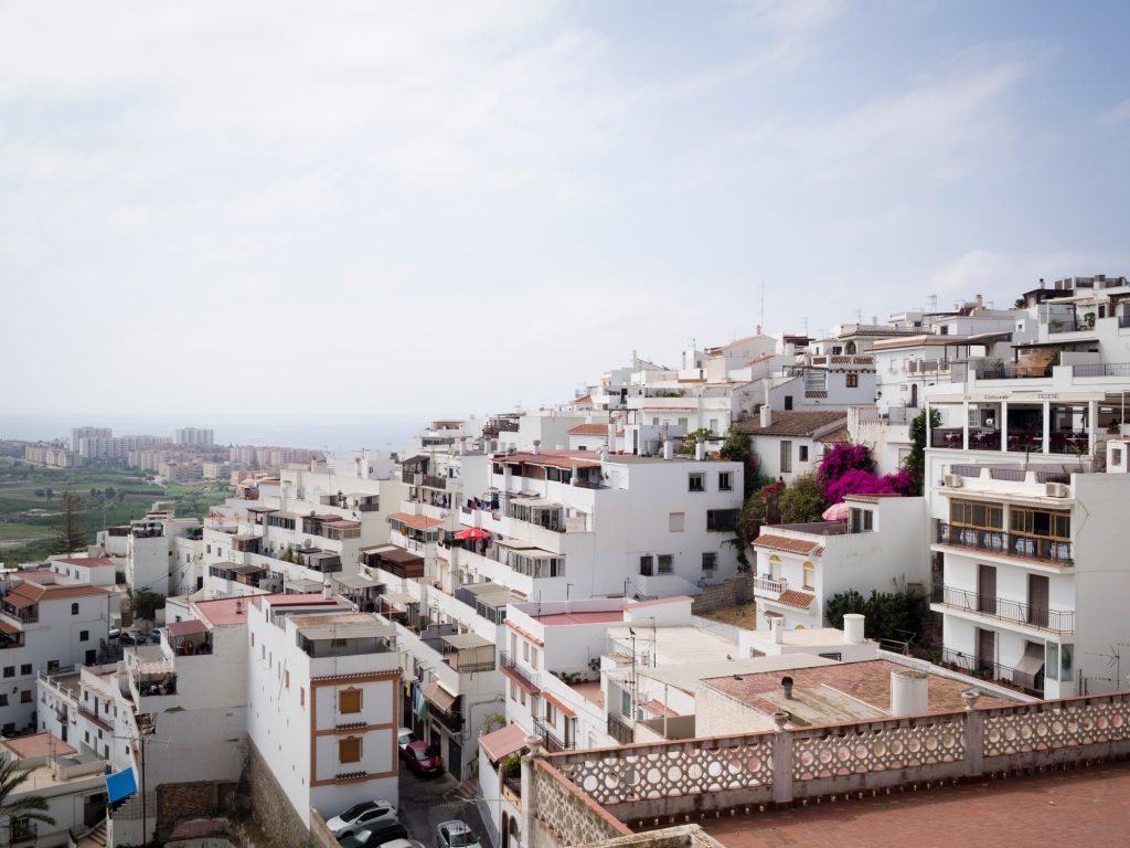 City with white buildings under the blue sky in Salobrena, Spain