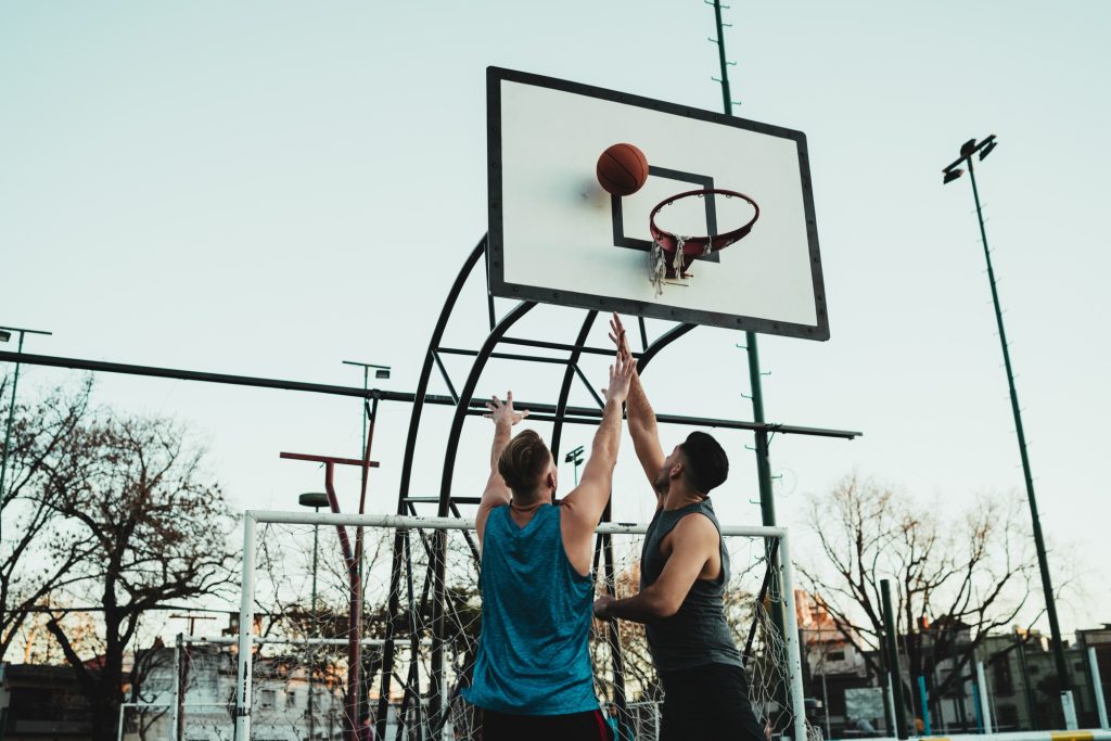 Young basketball players playing one-on-one.